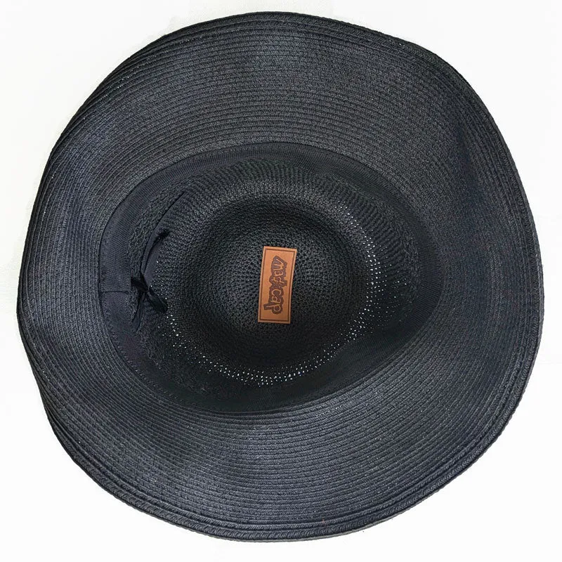 Packable black straw hat with button trim and lovely crochet textures, wired brim edge, adjustable fit